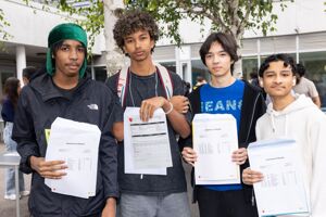 Haverstock GCSE students with Christopher Puddicombe (far left) and Taheem Islam (far right)